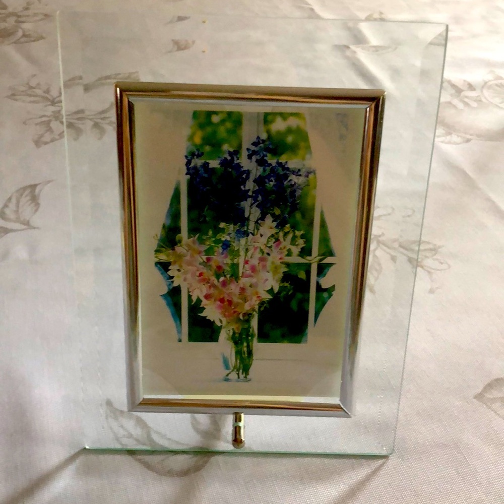 Pretty glass frame. Inside frame holds 5x7 picture.